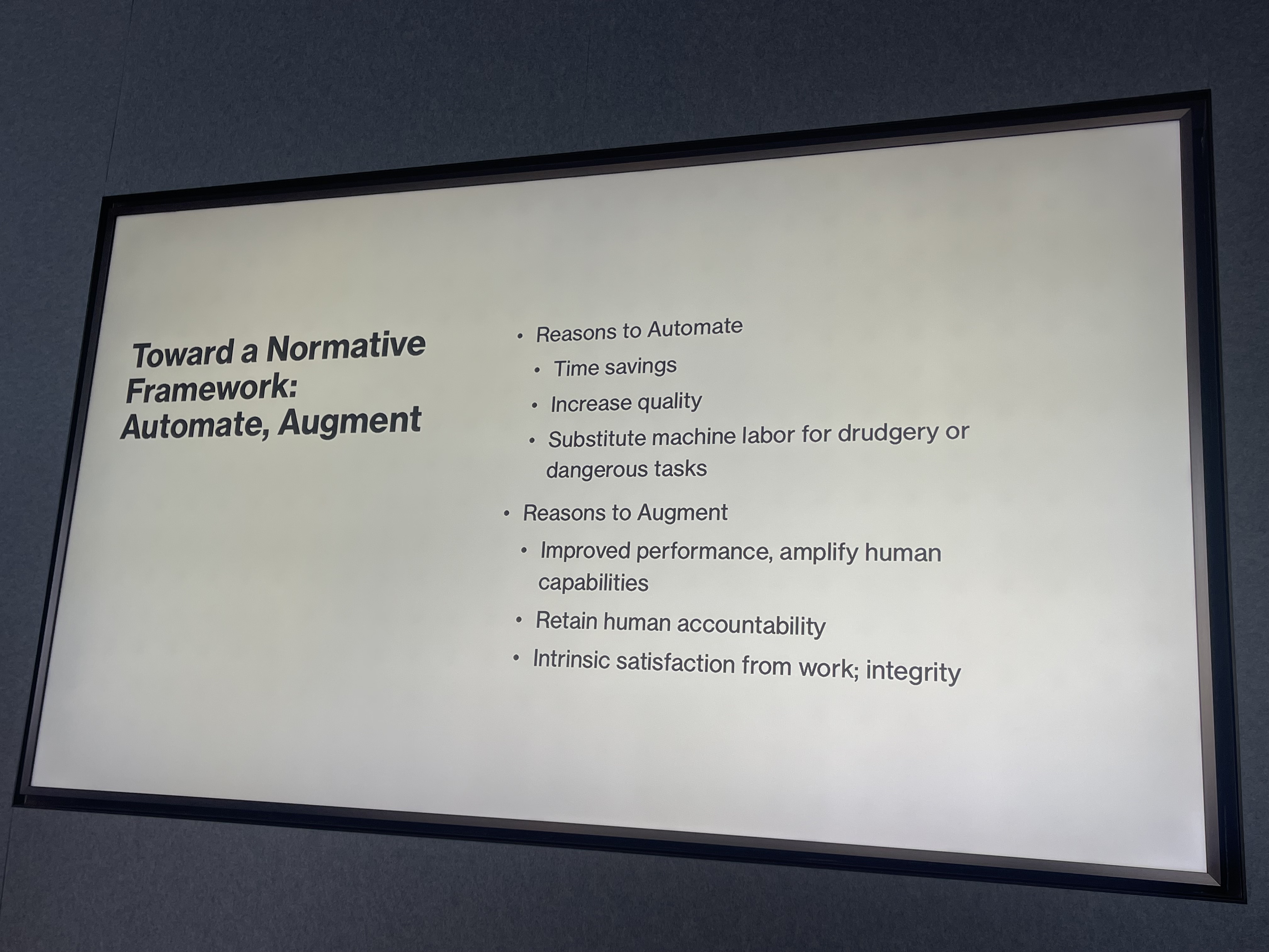 Slide titled 'Toward a Normative Framework: Automate, Augment'. Reasons to Automate: Time savings; Increase quality; Substitute machine labor for drudgery or dangerous tasks. Reasons to Augment: Improved performance, amplify human capabilities; Retain human accountability; Intrinsic satisfaction from work; integrity.